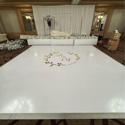 White gloss vinyl dance floor installed in a ballroom